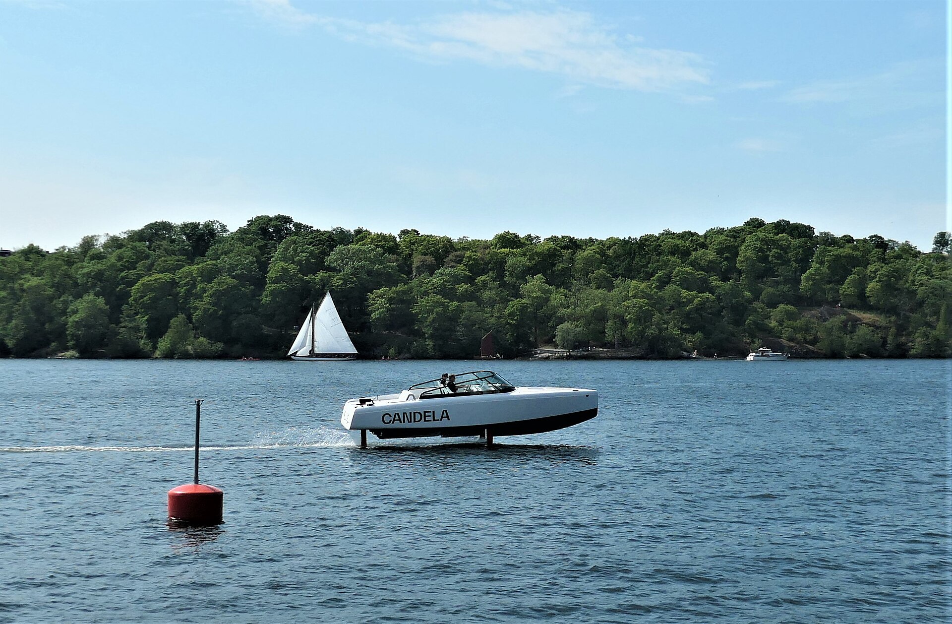 Candela C-8 hydrofoil on Riddarfjärden during Stockholm City Hall regatta in June 2023. In the background the