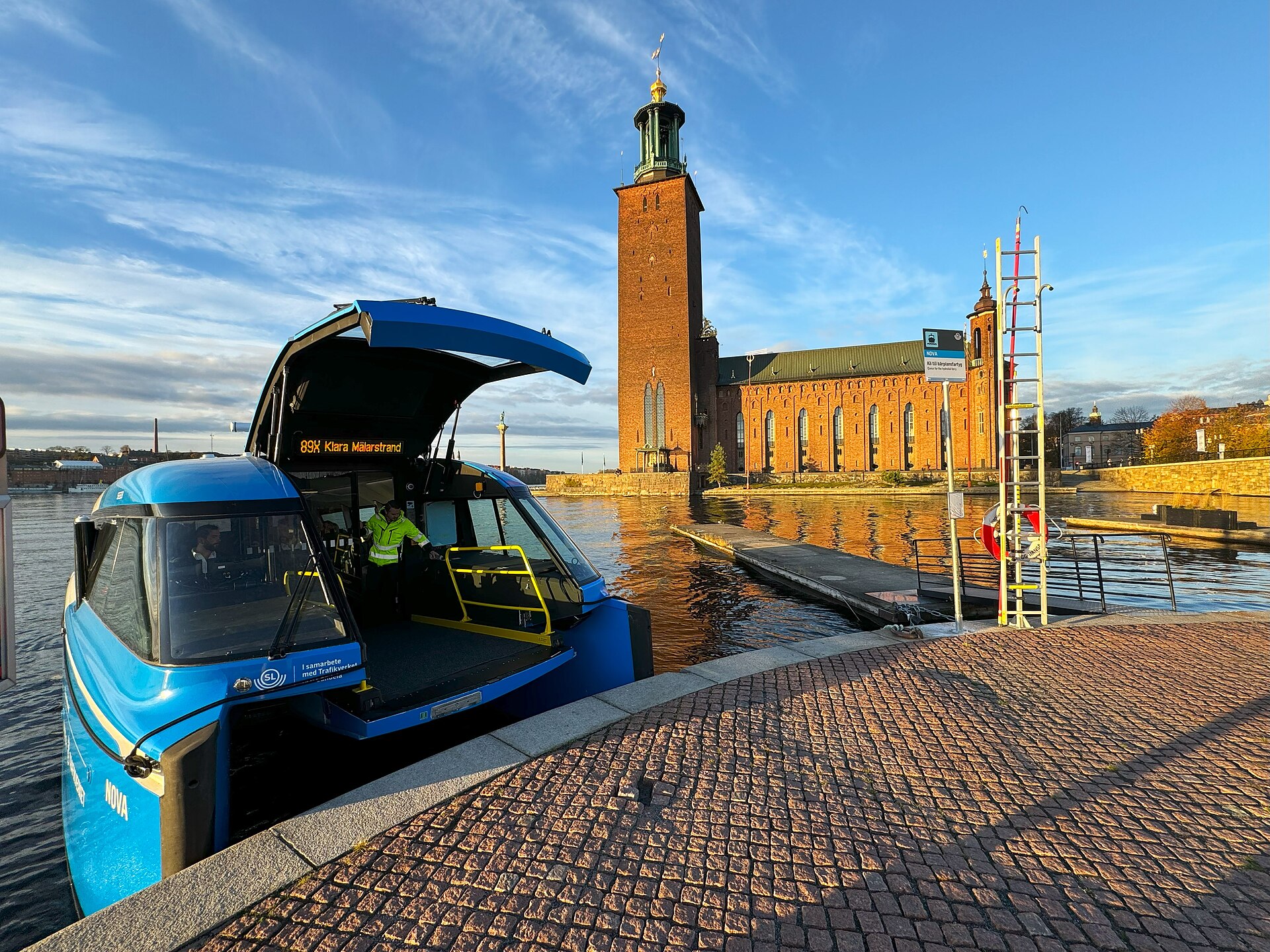 The hydrofoiling electric ferry E/S Nova ready to dock at Klara Mälarstrand close to the City Hall of Stockhol
